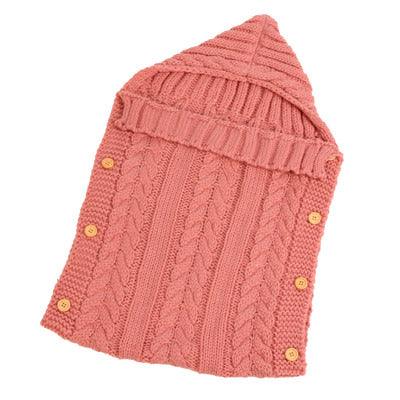 Gigoteuse en tricot saumon pour que bébé soit confortable