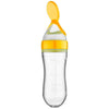 Cuillère à presser jaune pour la purée de bébé