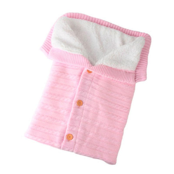 Gigoteuse en velour rose pour que bébé soit confortable