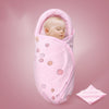 Sac de couchage rose pour emmailloter bébé