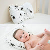Coussin anti tête plate pour bébé avec motifs étoiles