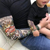T-shirt manche longue pour le bébé avec effet tatouages sur les manches